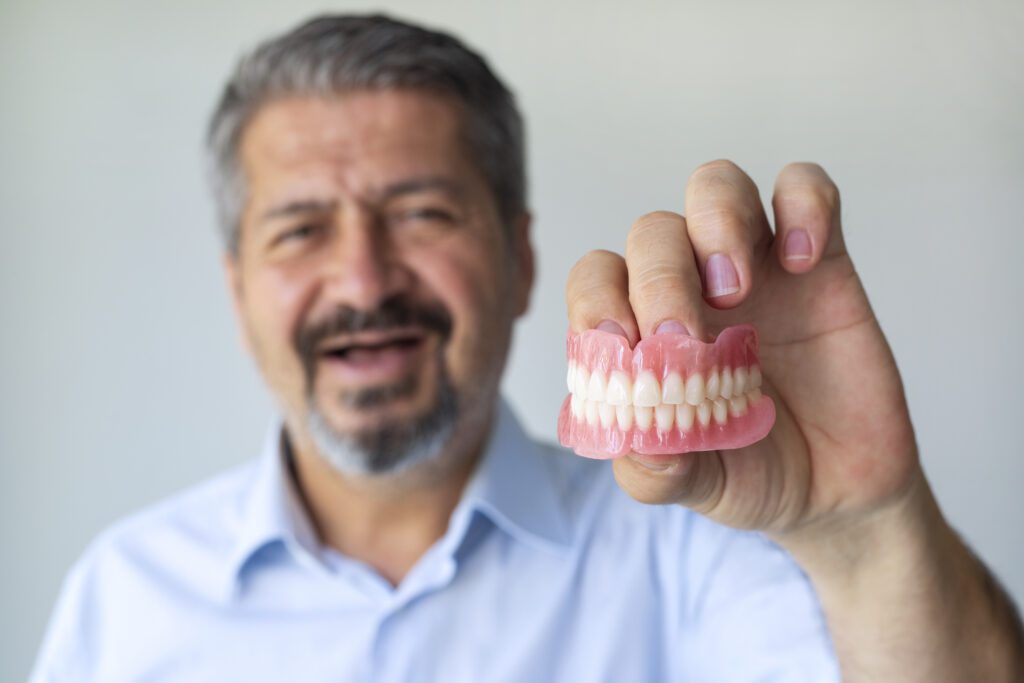 Choosing between implant and traditional dentures involves careful consideration. Each type offers distinct advantages and challenges.